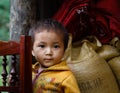 Children standing in font of his home